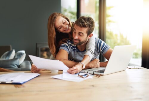 Cropped shot of an affectionate young couple working on their household budget