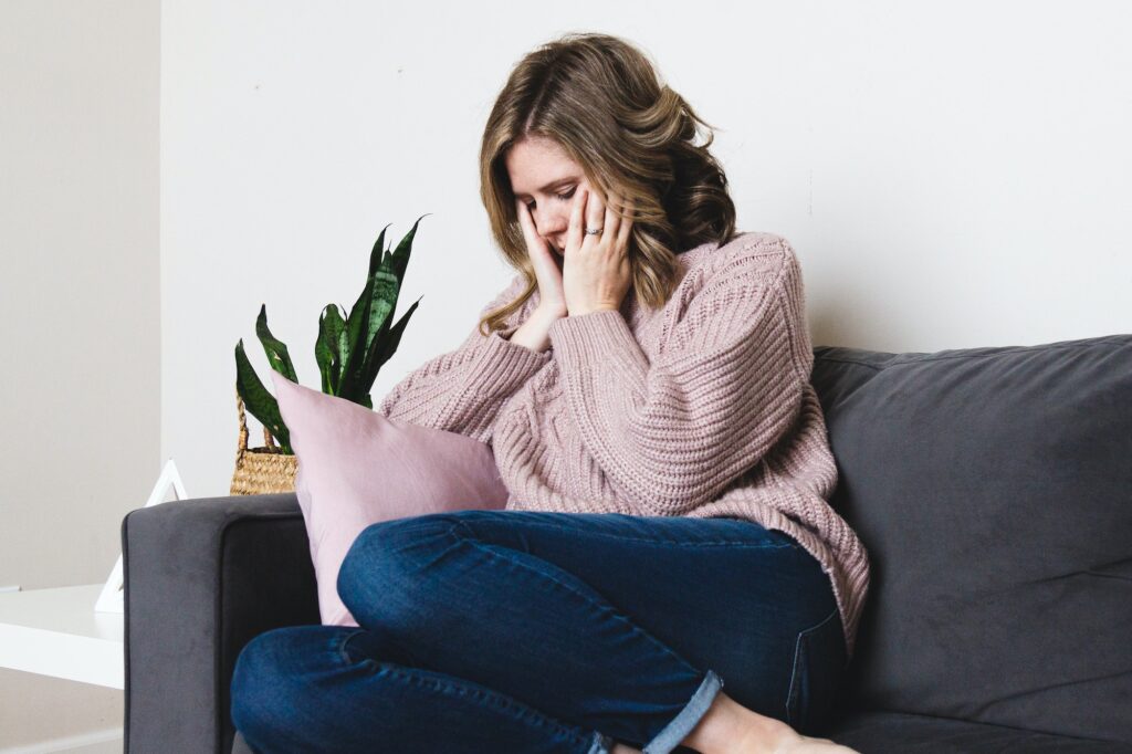 Woman sitting and worrying about mental health and depression
